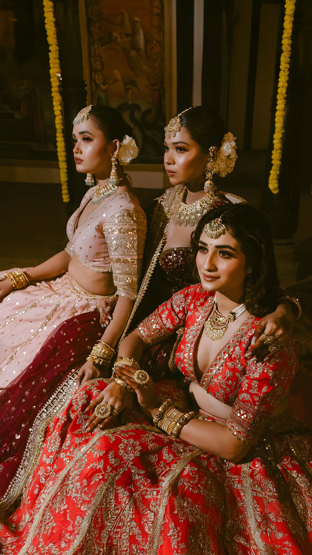 Bride getting ready for her wedding and posing with friends for a photoshoot
